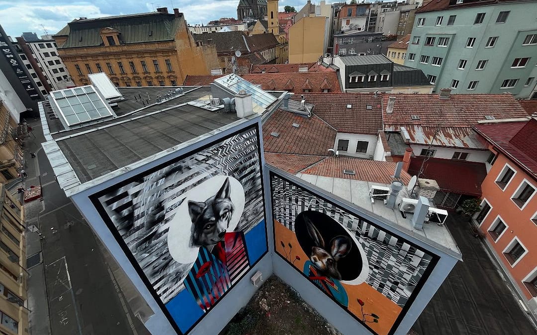 Největší pouliční malbou v Brně se stal obří mural s vlkem a zajícem